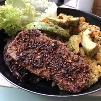 Pepper seitan steak with pumpkin quinotto, caramelizes onions and avocado at Veggiezz - Opernring in Vienna