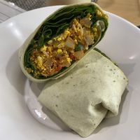 Vegan breakfast burrito (tea-chata with oat milk in the background)  at The Modern Tea Room in Lancaster