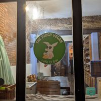 view from outside (at night) at The Judgy Vegan in Brussels