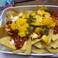 Nachos with jalapeños, bell peppers, kidney beans, cream cheese, cheese & salsa at The Judgy Vegan in Brussels