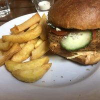 Burger plate feels bare when it arrives   at The Judgy Vegan in Brussels