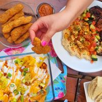 big loaded nacho dish with loads of other food at The Judgy Vegan in Brussels