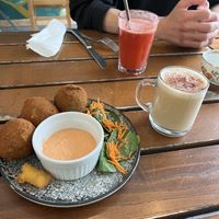 Arranchinis and cappuccino   at The Judgy Vegan in Brussels