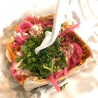 Baba Nahm's falafel pita (with humus, Israeli salad, pickled vegetables, Arab pickles, lettuce, parsley salad & lemon tahini): a hearty, fresh meal for a mere $4.95. at Baba Nahm in Asheville