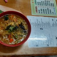 Curry noodles and menu on the table at Jiu Liu Su Shi in Taichung