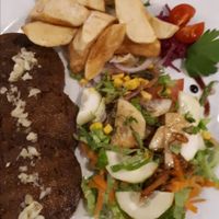 Seitan with salad and a mustard based sauce at C19 in Albufeira