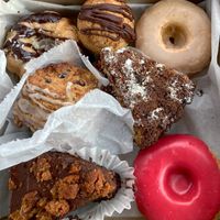 Choc. Chip Bundt cake, coconut macaroon, maple donut, lemon berry scone, raspberry coffee cake, PB Cookie Monster cake, raspberry donut! at Sweet Alchemy Bakery and Cafe in Essex Junction