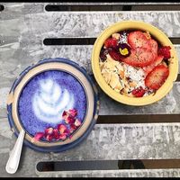 Acia bowl and blue butterfly latte  at Farm Girl Cafe in West London