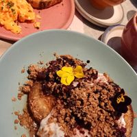 Vegan pancakes with roasted pear compote, coconut yoghurt, granola and marple syrup at Farm Girl Cafe in West London