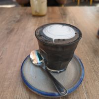 Black latte at Farm Girl Cafe in West London