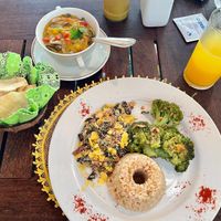 ‘Plate of the Day’:
Brown rice, broccoli with garlic, farofa(delicious), cassava chips and mushroom stew. at Nacasadela in Penedo
