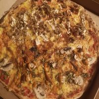 Half serán-mustard, half romescu pizza at Pizzeria Trozo in Bilbao