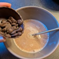 Whisking in the chocolate at The Old Chocolate House in Bruges