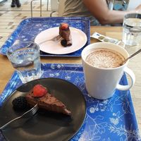 Raw vegan chocolate cake and a vegan chai latte at Kaffila in Tampere