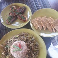 Aubergine in tomato ginger sauce, tempe, stir fried banana flowers and red rice at Catur'z Coffee Club in 
