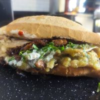 Torta de chilaquiles with extra Bistek meat at Por Siempre Vegana Vol II in Mexico City