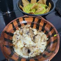 An order of guacamole (so so good!) and the Champiqueso (comes with tortillas and your choice of toppings!) at Por Siempre Vegana Vol II in Mexico City