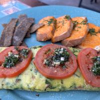 Omelette with spinach and milanesa   at Por Siempre Vegana Vol II in Mexico City