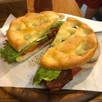 Vegan focaccia with roasted eggplant, capsicum (peppers), zucchini, and onion, fresh tomato, sun dried tomato, and lettuce. Yum. Lovely and crispy. at Pan e Vin in Corniglia