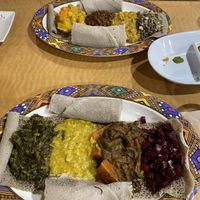 Both plates completely vegan, a mix of lentil dishes and vegetables!  at Goorsha in Durham