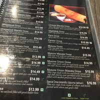 One page of the multi-page menu: notice how most of the items (18 on this page alone) are vegan (marked with green V) at Saravana Bhavan in New York City