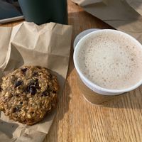 Oatmeal cookie with raisins, cranberries & walnuts and an oat milk hot chocolate   at Beach Pea Baking Co in Kittery