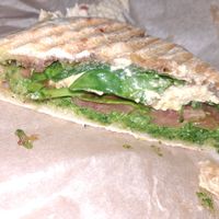 Panini - cashew cheese, tomato, spinach, v pesto at Waveriders Coffee & Deli in Nags Head