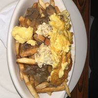 Vegan Poutine w/ house tofu "feta" and mushroom gravy   at Oak  in Seattle