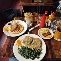 Tenders and waffle, biscuits and gravy with kale,  tofu scramble, tofu bacon,  Cloud9, black coffee. at Oak  in Seattle