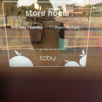 store hours on window at TCBY in Victor