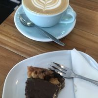 Cropped due to already having started the cake... flat white art 😃 at Vero Caffe in Bruges