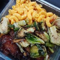 Brussels sprouts, drumsticks, and two portions of mac-n-cheese.  $8.75 and more than enough food for one person.   at Veggie Castle in Jamaica