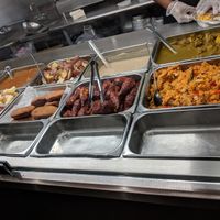 Hot food. Was still early so not everything was out at Veggie Castle in Jamaica