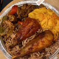 Barbecue drumsticks, jerk chicken, Mac &cheese, rice and peas at Veggie Castle in Jamaica