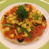 TINY pizza. Not worth it because of small size and boring taste. at Loving Hut - Hoa Dang in Ho Chi Minh City