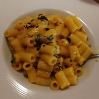 Blurrred photo of noodles with tomato sauce at Posta Zirm Hotel in Corvara In Badia