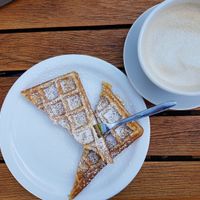 vegan waffles (very fluffy!) and a cafe latte with oat milk at Kaffeeflut in Wittdun