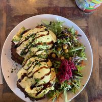 Fritters with avocado main and poached egg  at Chickpea Restaurant in Vancouver