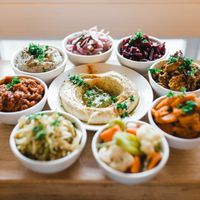 Salatim-Add the colours of the rainbow to your table with our assortment of delicious side salads. at Chickpea Restaurant in Vancouver