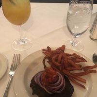 Portabella mushroom burger no bun and AMAZING sweet potato fries with a white sangria  at Magnolias in Charleston
