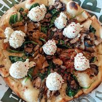 Recent view of the thinner crust spinach mushroom pizza and (lots of) lemon almond ricotta at True Food Kitchen in King Of Prussia