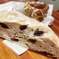 Olive bread and vegan Chelsea cinnamon bun  at The Cheese Room  in Rochester