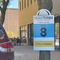 QC Half Marathon signage with Healthy Harvest in the background  at Healthy Harvest Urban Farms & Cafe in Rock Island