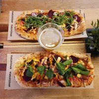 Two own-compositions with vegan bacon and a different selection of cheese and veggies at Pizzatopia in Krakow