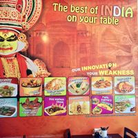 Mural on the wall with lots of food pics  at Go Chaatzz in Fremont