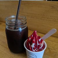 Soy soft serve with raspberry topping and iced coffee. at Ballon in Tokyo