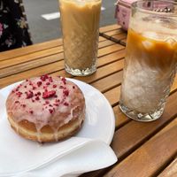 Raspberry donut and iced lattes at Donut Shop in Prague