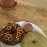 matcha, pretzel with Chocolate and a cinnamon ball  at Donut Shop in Prague