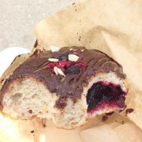 Delicious chocolate donut filled with jam. at Donut Shop in Prague