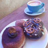 Oat milk cappuccino at Donut Shop in Prague